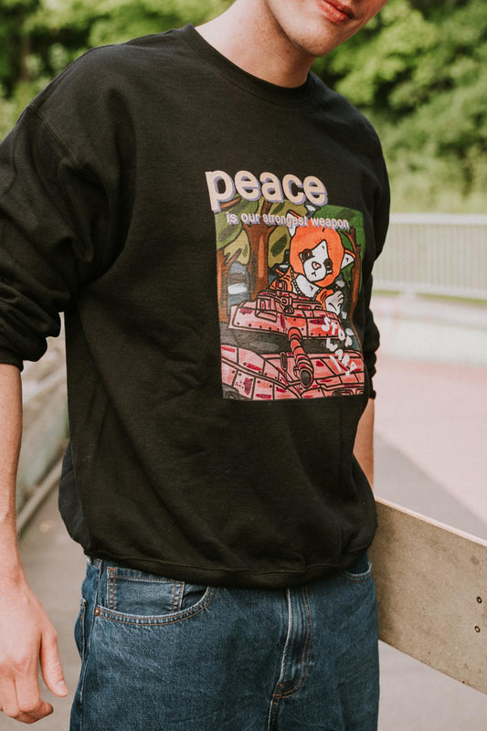 "Peace Is Our Strongest Weapon" – Klassischer Unisex Pullover