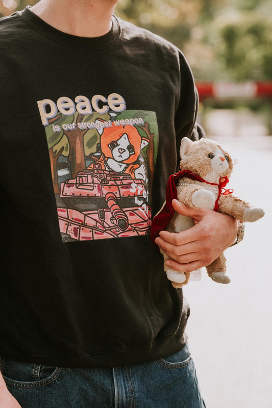 "Peace Is Our Strongest Weapon" – Premium Unisex T-Shirt